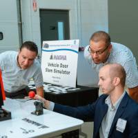 A student explaining his project, Vehicle Door Slam Simulator